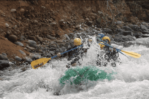 a group of people in a white water rafting